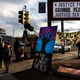 Young boys walk past George Floyd Square in Minneapolis, Minnesota on April 21, 2021, a day after Derek Chauvin was convicted.